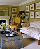 Upholstered wing back chair and sofa in yellow sitting room