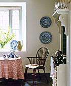 Windsor chair and round breakfast table next to Aga