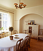 Traditionally Swedish dining room with dining table and Gustavian chairs