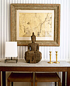 Lamp candlesticks and Buddha figure on side table