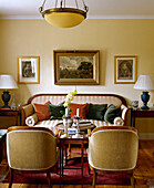 Traditional yellow sitting room period sofa armchairs side tables interiors rooms