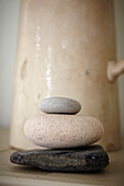 Three pebbles and ceramic jug in Port Issac beach house Cornwall