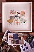 Framed chairs and fabric samples in work studio of upholsterer