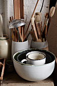 Tools and bowls on workbench in Brighton studio of ceramic artist