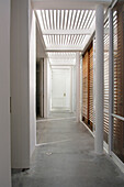 Hallway shaded with pinewood and polycarbonate covering
