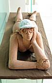 Full-size sculpture of a woman sunbathing