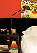 Black headboard and contemporary art with Tolomeo desk lamp