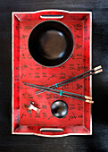 Elevated view of Chinese chopsticks and bowl