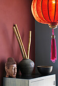 Chinese lantern and sculptured Buddhist head
