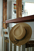 Sun hat on bar stool at kitchen bar area