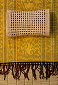 Indian headrest on yellow fabric cloth