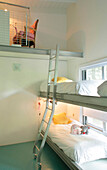Stainless steel bunk beds with mezzanine platform and ladder