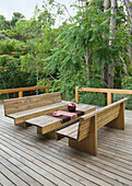 Bench seats on outdoor woodland terrace