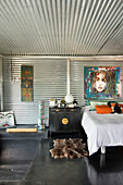 Galvanized metal bedroom with Chinese bedside cabinet and modern art
