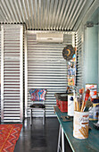 Galvanized metal room with artist's materials