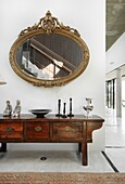 Antique cabinet and mirror in modern luxury farm house, Uruguay