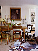 Wooden dining furniture below portrait in 17th Century Oxfordshire house