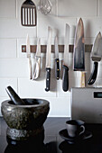 Pestle and mortar with magnetic knife storage in 1820s Georgian townhouse kitchen