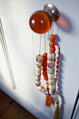 Orange glass door knob with beads