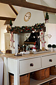 Painted table with Christmas decorations in barn conversion