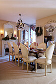 Cream dining room with understated Christmas decorations