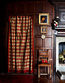 Curtained doorway in panelled Grade I listed Elizabethan manor house in Kent 