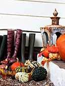 Wellington boots and pumpkins on Edwardian school house doorstep 