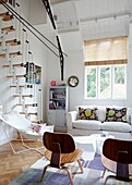 Sunlit living room of Edwardian school house conversion with Italian staircase which arrived in kit-form