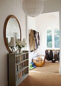 Bookcase with mirror in entrance hallway of Edwardian school house conversion