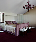 Bedroom furnished in shades of purple