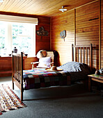Sunlit panelled bedroom with crotchet blanket Masterton New Zealand