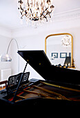 Grand piano and matching chairs in reception room of London home