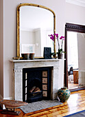 Mirrors at fireplace of London home