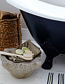 Freestanding bath with basket and backbrush and soaps