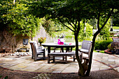Seating area on shaded patio of country house