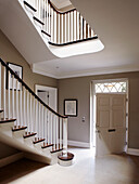 Elegant wooden staircase in townhouse entrance hall