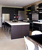Dark wood kitchen with an immaculate contemporary finish