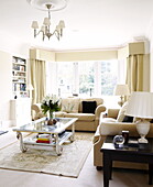 Two sofas and a glass topped table in living room of Harrogate home Yorkshire England UK