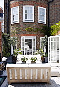 Brick exterior of luxury courtyard garden London home UK