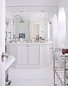 White bathroom detail with silver fittings in London home UK