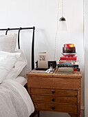Books and valentines card on wooden bedside table in contemporary home, Hastings, East Sussex, UK
