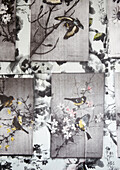 Hand coloured oriental prints of birds in tree branches in contemporary home, Hastings, East Sussex, UK