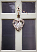 Heart shaped Christmas ornament on front door of Oxfordshire home, England, UK