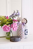 Cut flowers with silver jewellery casket and pot pourri in Oxfordshire cottage, England, UK