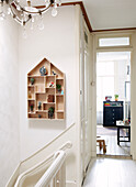Wall mounted ornament shelf on landing of contemporary apartment, Amsterdam, Netherlands