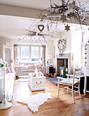 Christmas decorations in white living room of Derbyshire farmhouse England UK