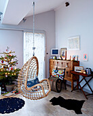 Hanging chair in living room of London family home England UK