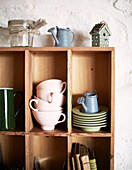 Kitchenware and ornaments in wooden shelving Brittany farmhouse France