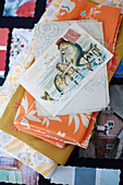 French postcard and folded fabrics in Northumbrian textiles studio England UK