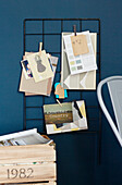 Postcard storage and wooden crate in work studio, UK